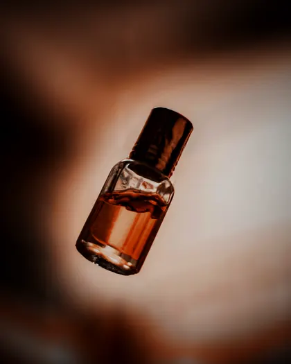 An amber oil bottle in warm light