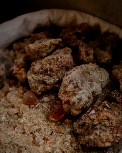 Amber frankincense pieces in a cloth sack